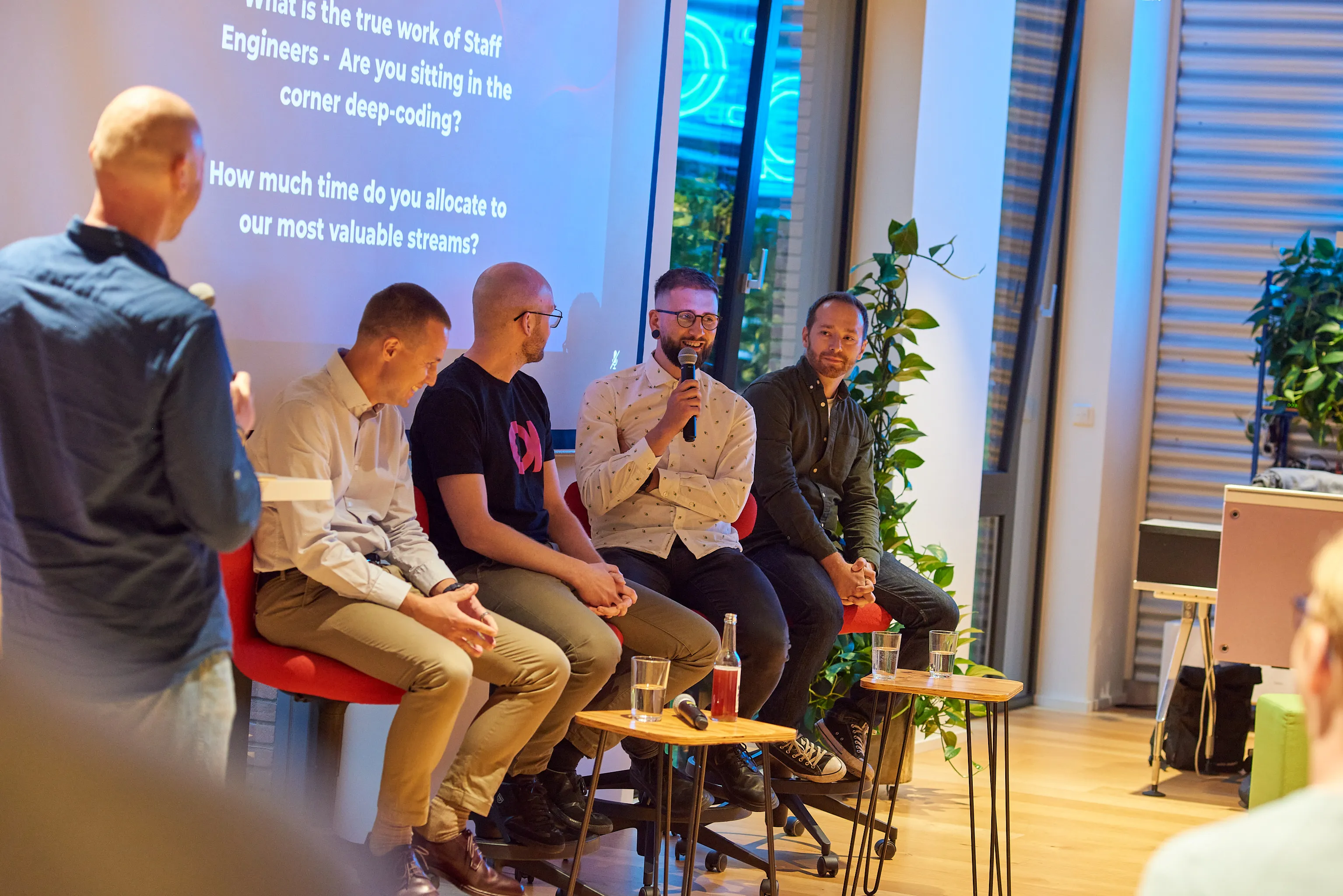 A panel of engineering leaders seated together on stage at an ELC event