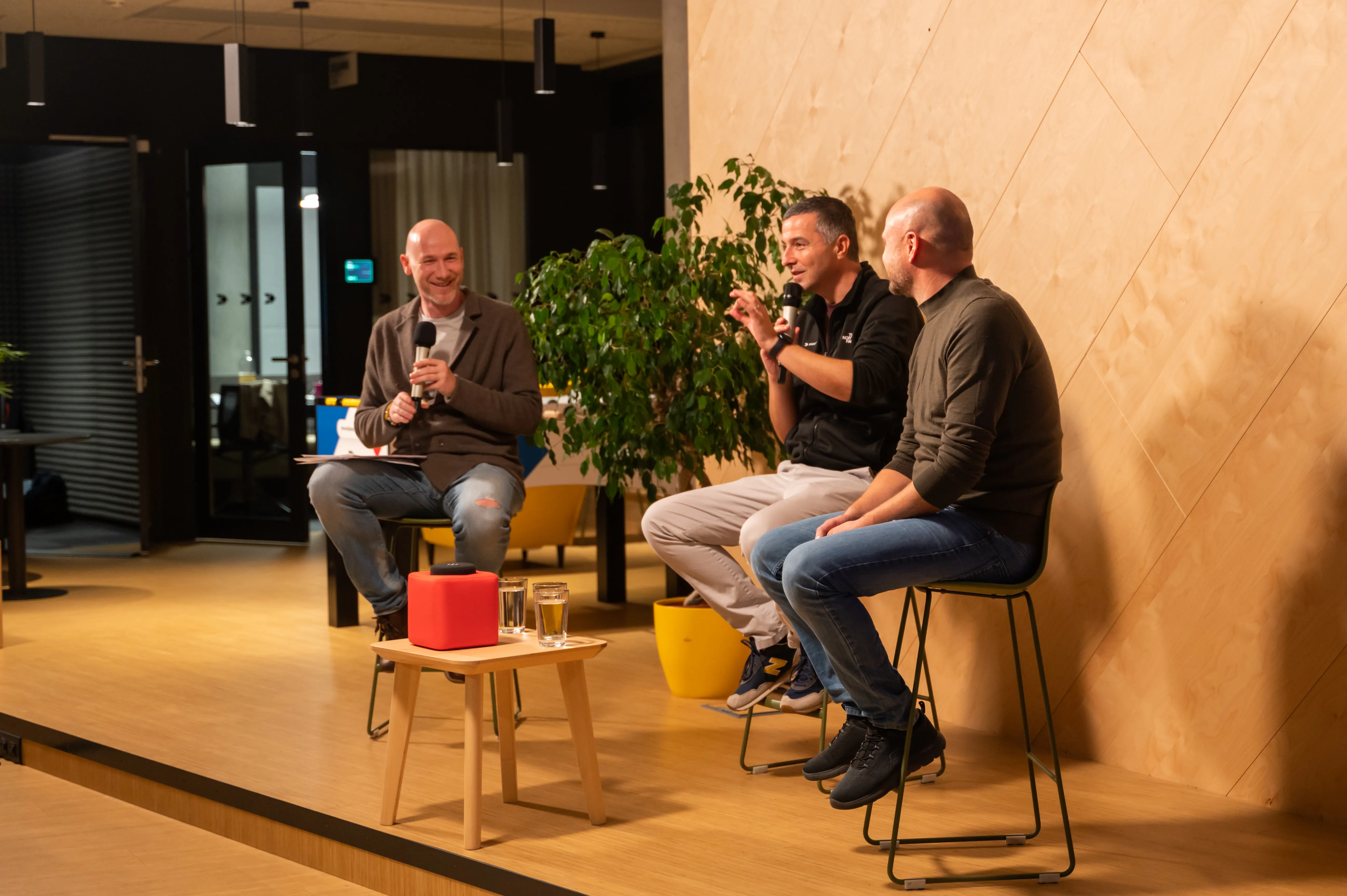 Speakers in conversation on stage at an ELC meetup