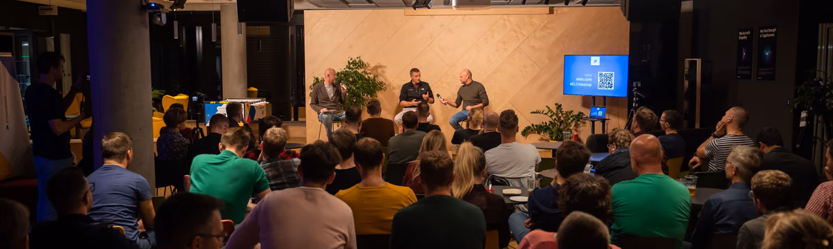 A full room of engineering leaders watching a panel at an ELC meetup, the source of the talks and recaps on this blog