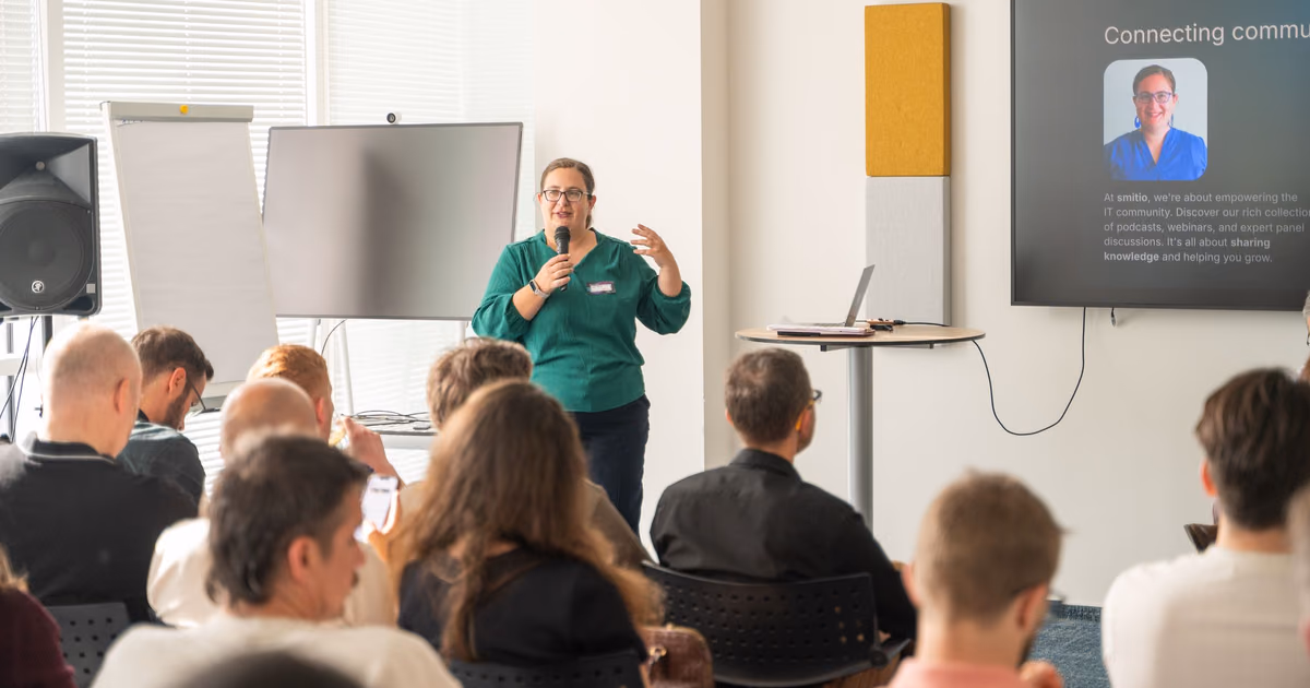 A speaker taking the floor in front of a full room at an ELC meetup