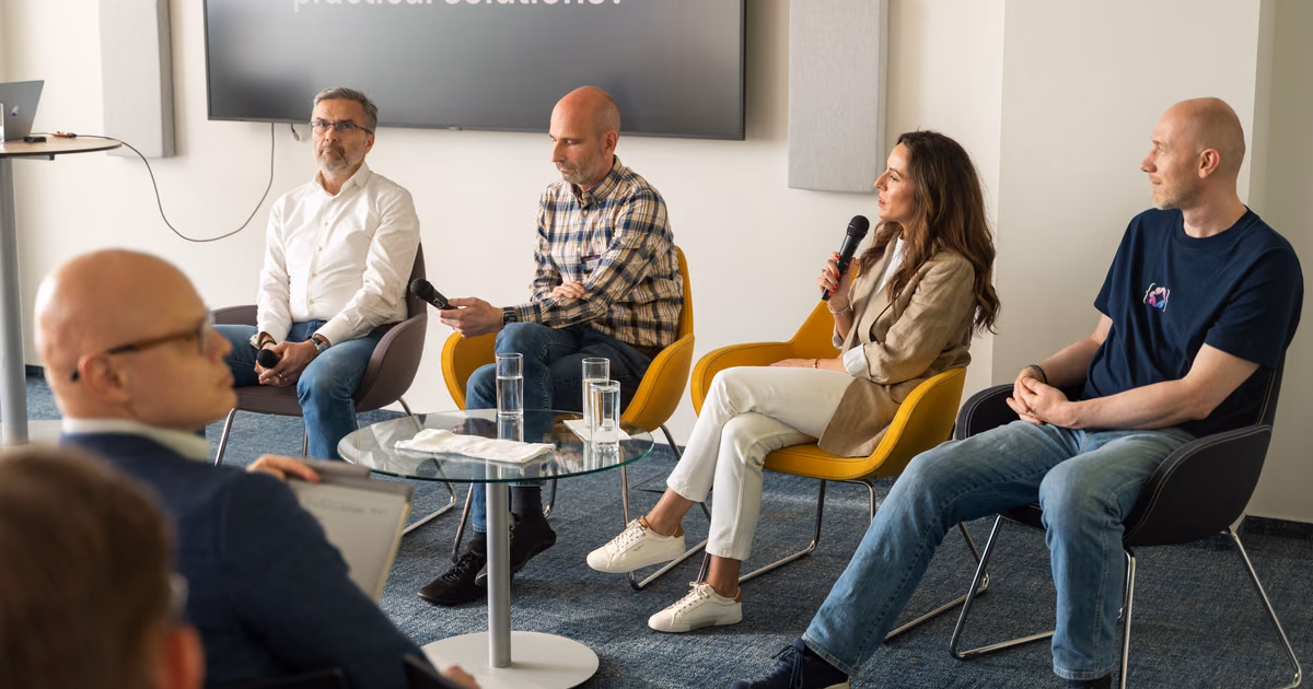 Five engineering leaders on a panel taking questions from the room at an ELC session