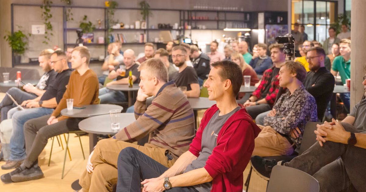 A full room of engineering leaders seated in a lounge-style venue at an ELC meetup