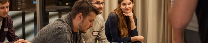 Two engineering leaders talking through a membership plan side by side at an ELC meetup