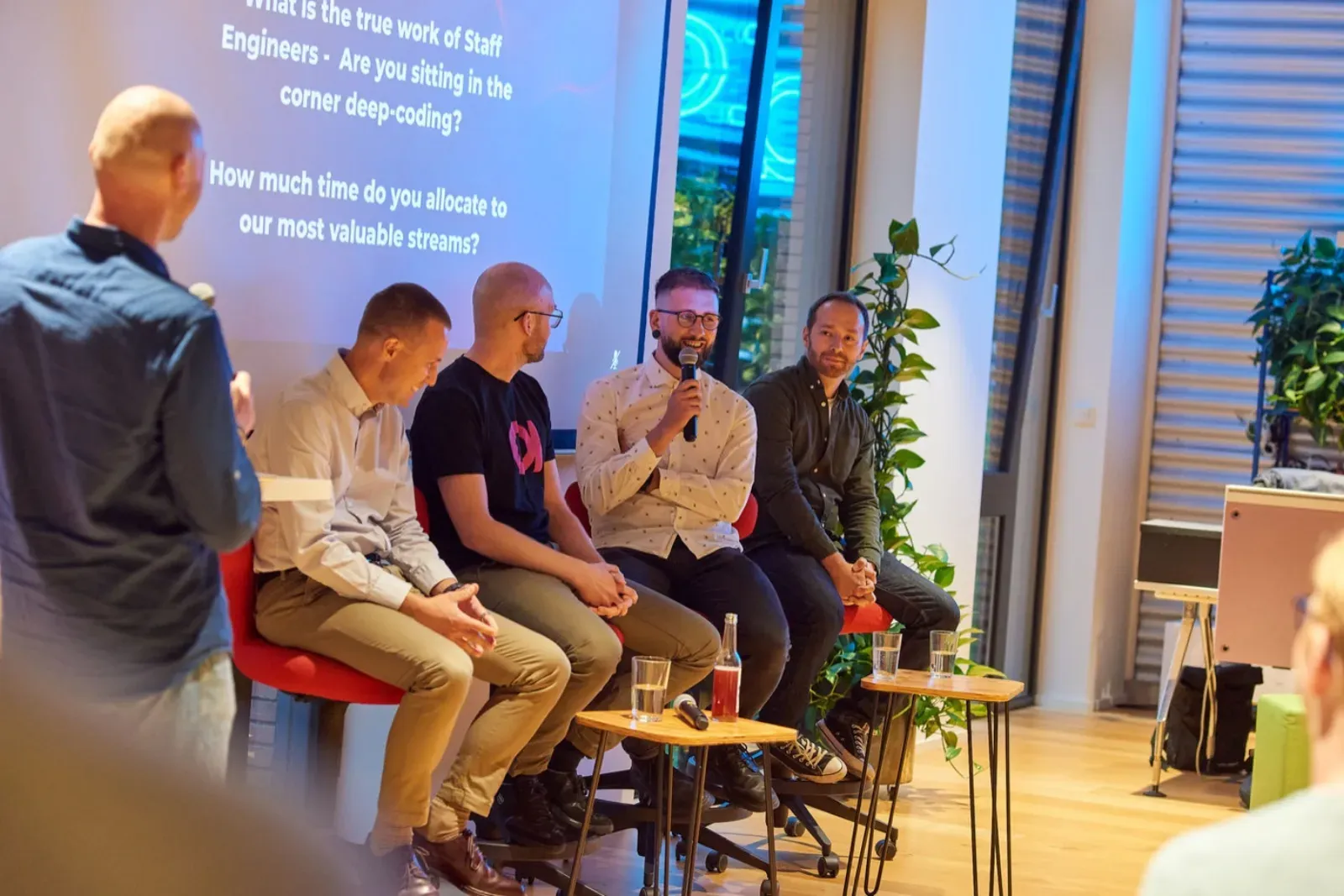 Engaged audience during a Q&A at an Engineering Leaders meetup